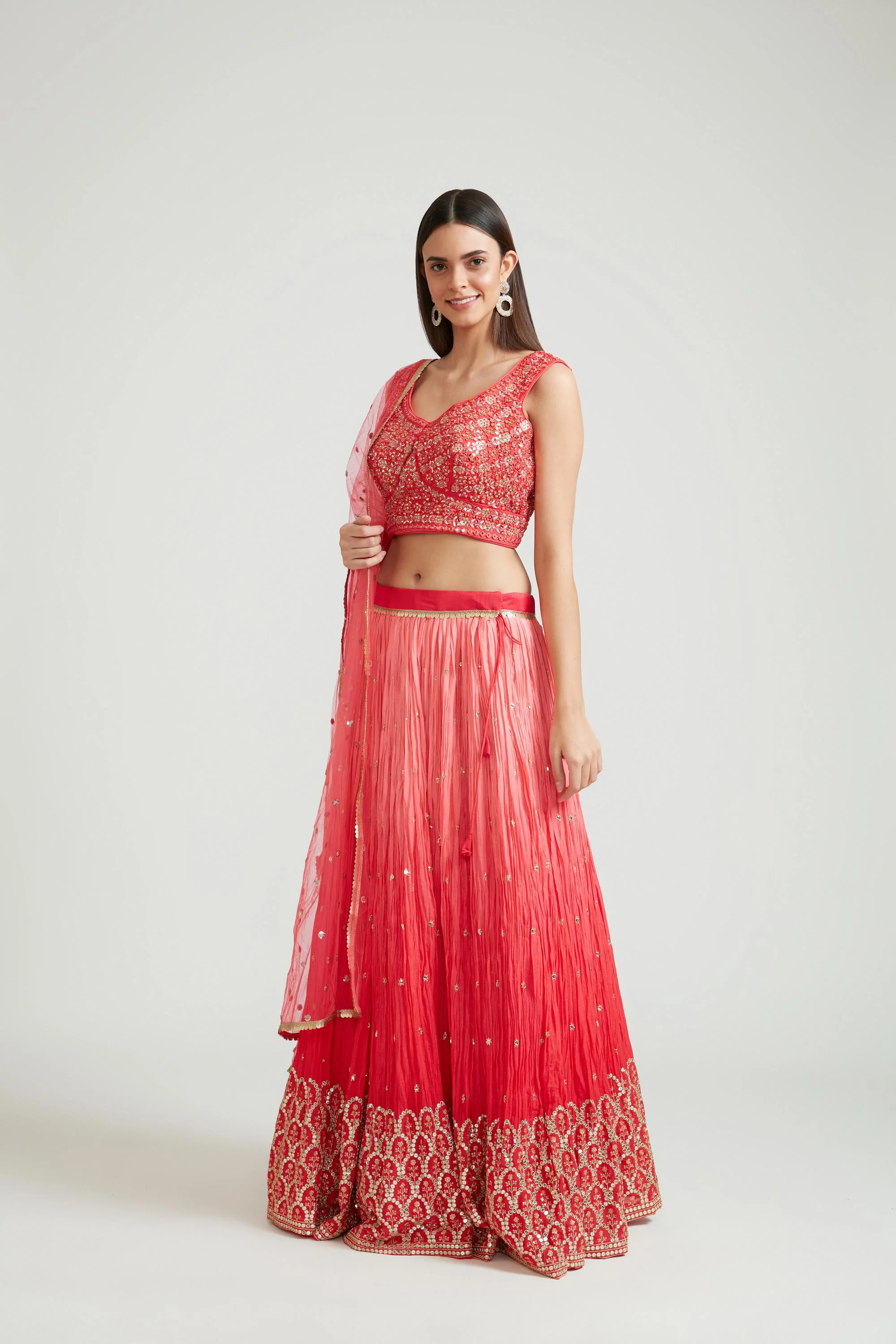 Neerus Tomato Color Silk Fabric Lehenga Choli