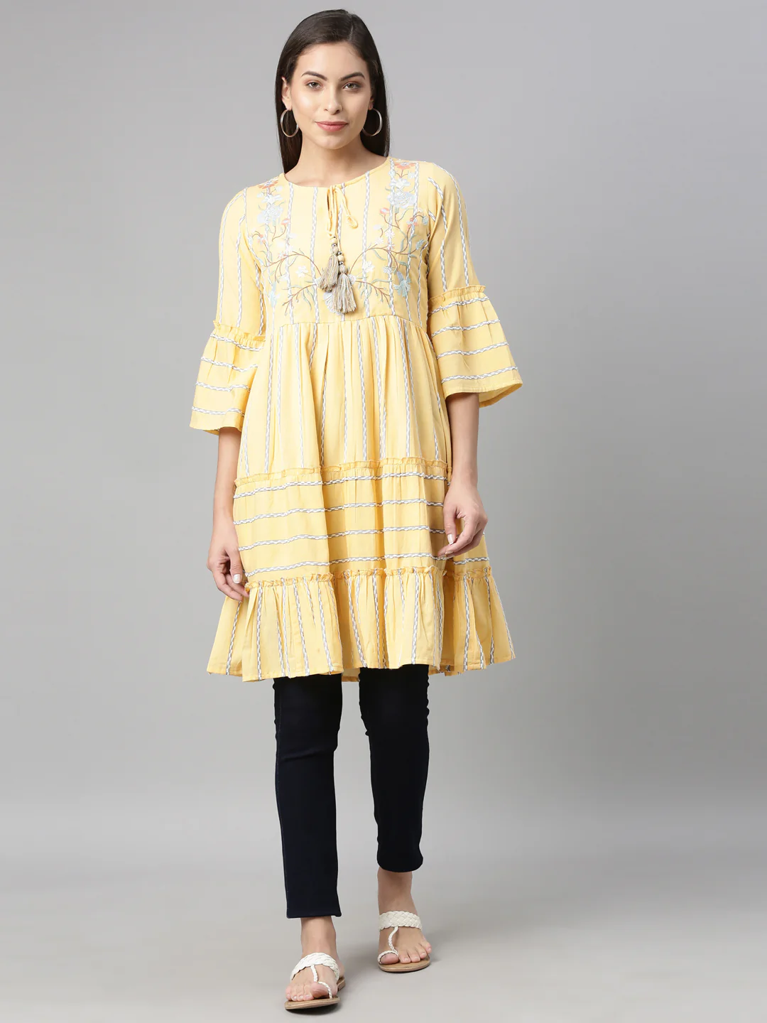 Neerus Yellow White Floral Yoke Design Flared Sleeves Tiered Kurti